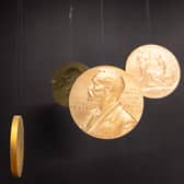 Replicas of the official Nobel Peace Prize gold medal.