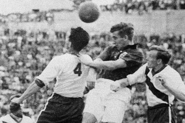 Tom Finney challenges with Charlie Colombo and Edward John McIlvenny during the World Cup first-round match between England and the United States in 1950 (Photo STAFF/AFP via Getty Images)
