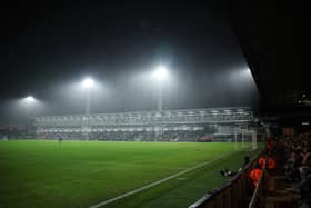 The Bobbers Stand under the floodlights.