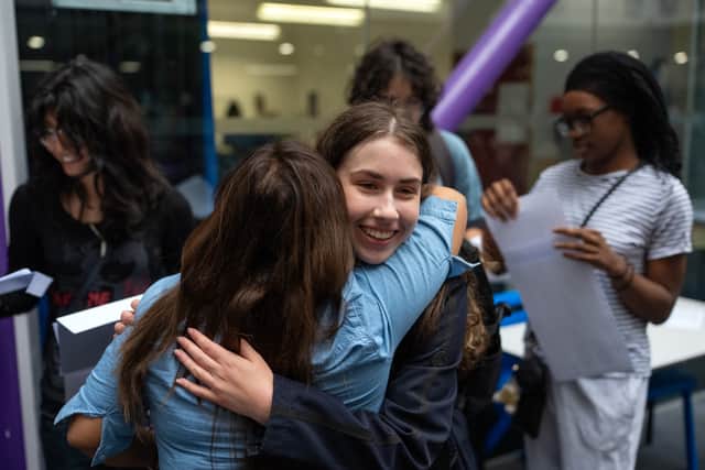Students react after receiving their GCSE results (Library picture)
