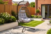 The stylish dark grey hanging egg chair could become the standout feature in any patio or garden setting