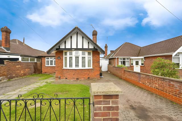 The generous frontage immediately highlights the extensive parking and spacious plot that set this Warden Hills home apart.