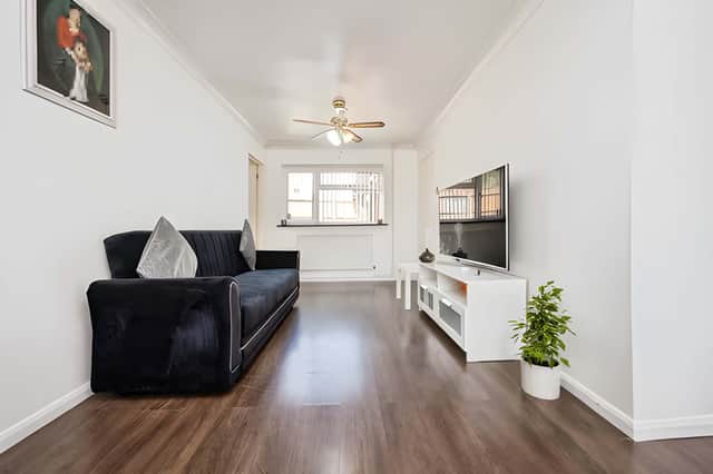 The comfortable living room is complemented by a separate dining room, giving the home two dedicated reception spaces