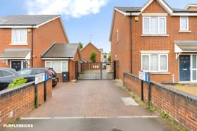 Set behind secure gates, the home has a private driveway and attractive green outlook at the front