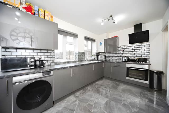 The modern kitchen/diner provides a contemporary space for cooking and family meals.