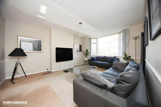 The bay-fronted living room offers a welcoming reception space.