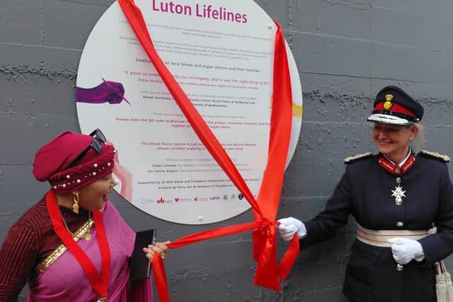 Councillor Fatima Begum, Deputy Mayor of Luton with Susan Lousada, HM Lord-Lieutenant of Bedfordshire, officially unveils the Luton Lifelines community created mural