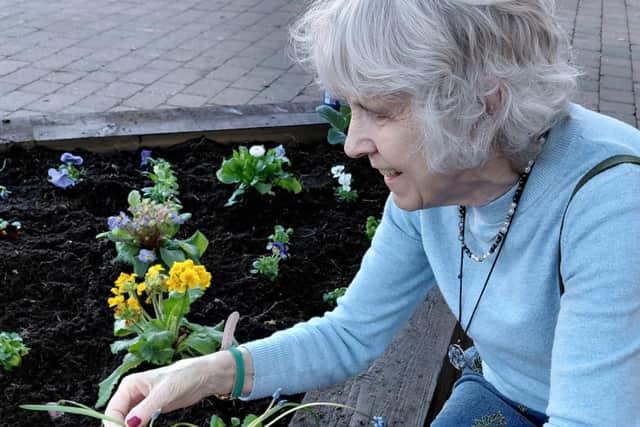Resident Mags Barton tends to the flowers