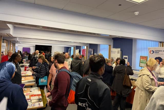 Attendees explore stalls and speak with local support organisations at Luton's World Mental Health Day Event.