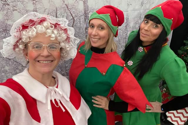 Mrs Claus with Santa's Two Cheeky Elves at Charity, Little Bramingham Farm Residential Care Home getting ready for Christmas.
