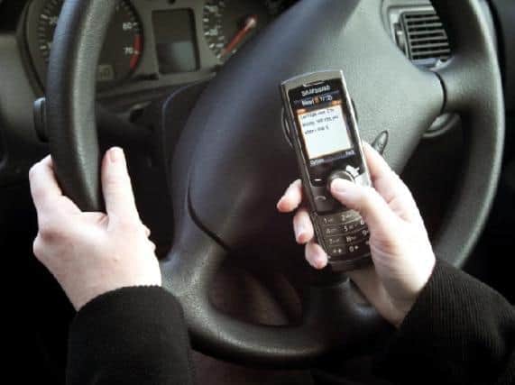 Crackdown on motorists who use a mobile while driving