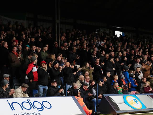 Town fans applaud owners 2020 during a home match last season
