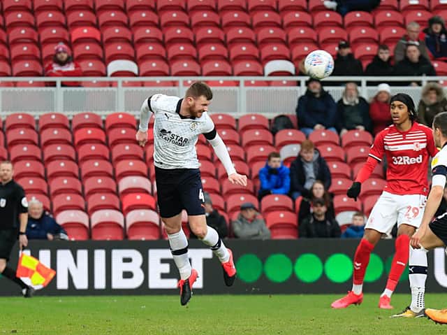 Ryan Tunnicliffe flicks the ball on against Middlesbrough