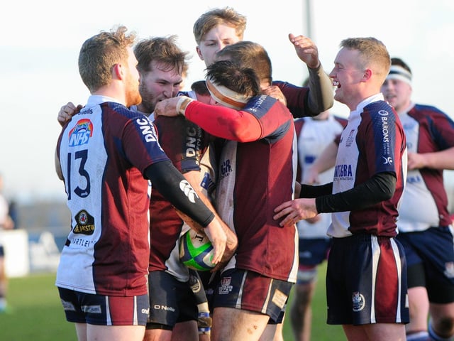 Sam Dawson is congratulated for scoring his side's third try in the 37-7 win for Scarborough RUFC against derby rivals Pocklington