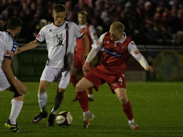 James Cadman gets stuck in against Whitby Town