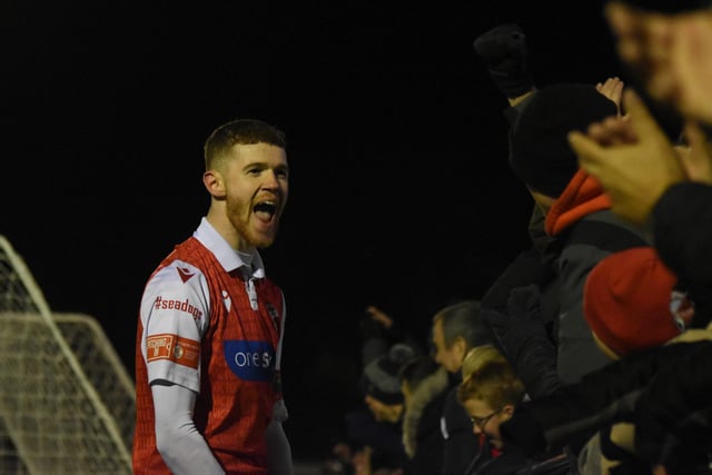 Kieran Glynn shares his delight with the Boro crowd after setting up the winner against Whitby Town