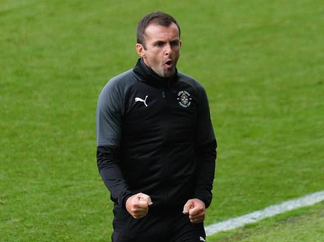 Hatters boss Nathan Jones celebrates the 1-0 win at Swansea yesterday