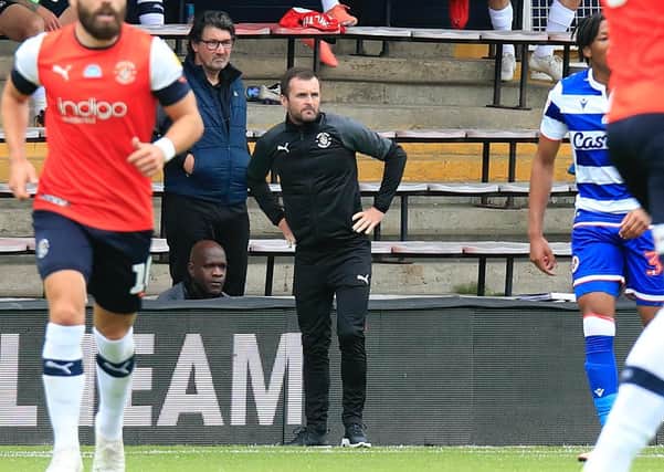 Nathan Jones watches on from the sidelines as his Luton side were thrashed by Reading this afternoon