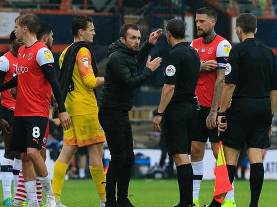 Hatters boss Nathan Jones makes his point to referee Dean Whitestone after Tuesday night's 1-1 draw with Barnsley