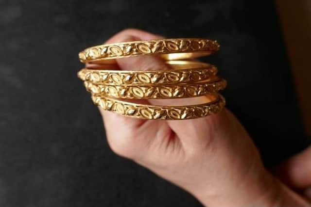 A set of four 22-carat gold bangles were removed from the victim's wrist