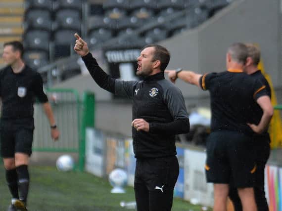 Hatters boss Nathan Jones give out some instructions at Hull on Saturday