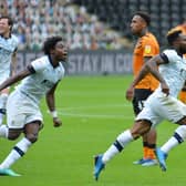 Kazenga LuaLua sprints off to celebrate scoring the winner for Luton at Hull on Saturday