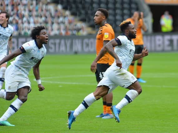Kazenga LuaLua sprints off to celebrate scoring the winner for Luton at Hull on Saturday