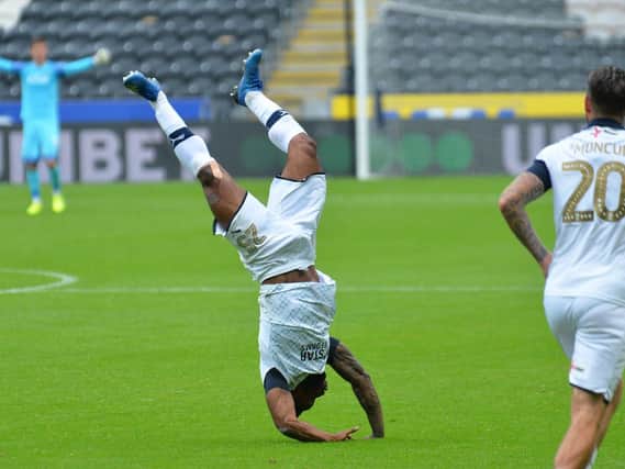 Kazenga LuaLua unleashes his acrobatics after scoring the winner at Hull City on Saturday
