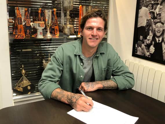 Glen Rea signs his new Luton contract