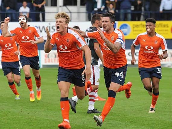 Cameron McGeehan celebrates a goal during his time with Luton