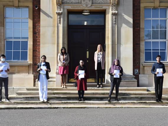 Staff and pupils at Denbigh High School celebrate a successful round of GCSEs