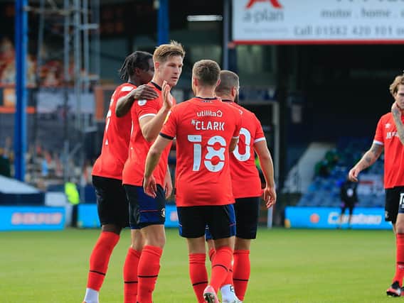 James Collins celebrates his match-winning hat-trick for Luton this afternoon