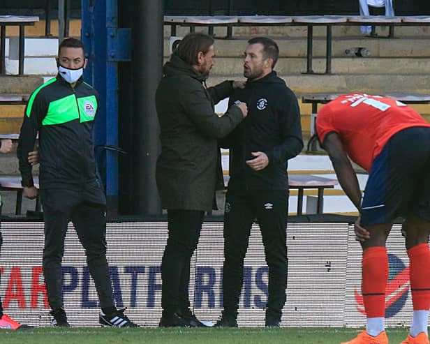 Nathan Jones chats to opposite number Daniel Farke at the final whistle on Saturday