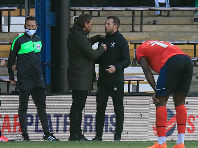 Nathan Jones chats to opposite number Daniel Farke at the final whistle on Saturday