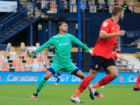 Town keeper James Shea gets the ball forward against Norwich