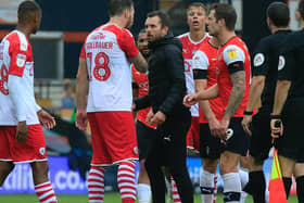 Nathan Jones confronts a Barnsley player after the 1-1 draw at Kenilworth Road last season