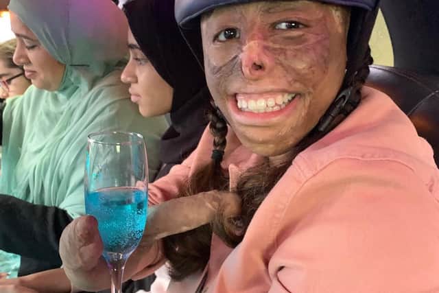 Shamiam enjoys a flute of non-alcoholic blue fizz in her birthday limo.