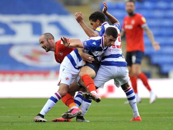 Danny Hylton is sandwiched by two Reading defenders during Tuesday night's 1-0 win over the Royals