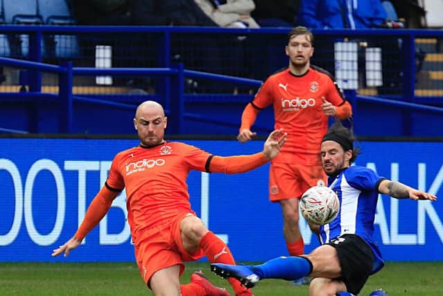 Alan McCormack slides in to win a challenge during his time at Luton