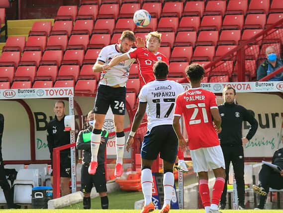 Rhys Norrington-Davies jumps to head clear against Barnsley on Saturday