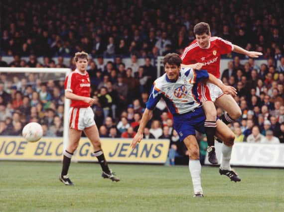 Mick Harford challenges Dennis Irwin for the ball during Luton's last match against Manchester United at Kenilworth Road in April 1992