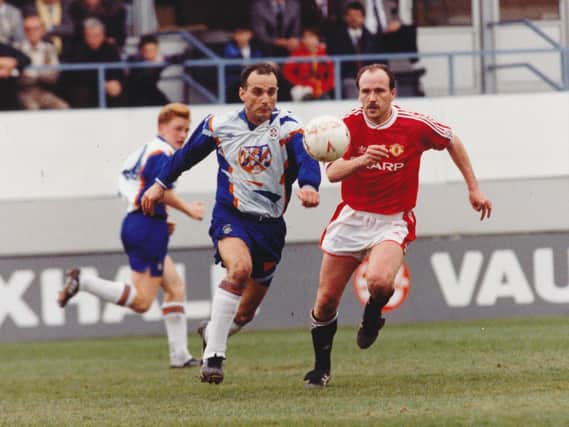 Imre Varadi races away from Mike Phelan during Luton's 1-1 draw with Manchester United in April 1992