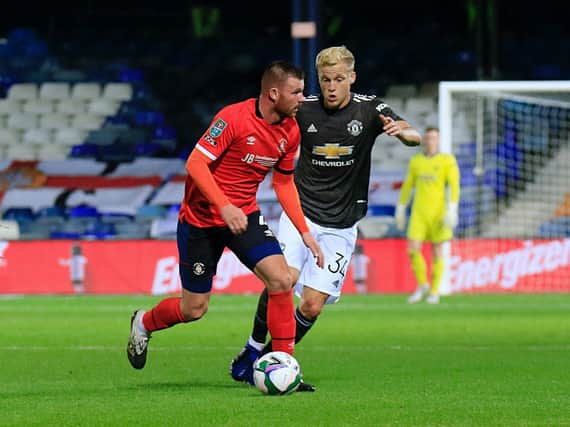 Ryan Tunnicliffe under pressure from Manchester United's Donny van de Beek on Tuesday night
