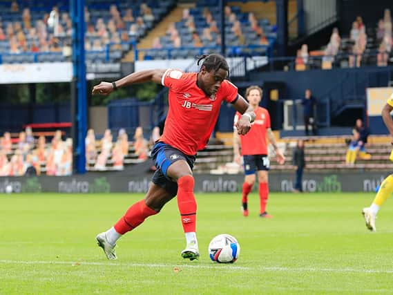 Luton midfielder Pelly-Ruddock Mpanzu bursts forward against Wycombe