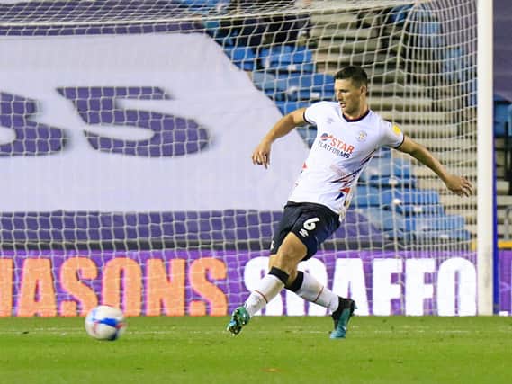 Matty Pearson makes a pass against Millwall on Tuesday night