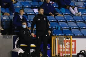 Luton boss Nathan Jones watches on against Millwall in midweek
