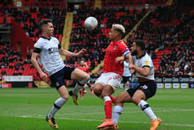 Luton try and double up on Lyle Taylor when the striker was at Charlton last season