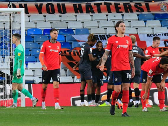 Luton's players react to visitors Brentford moving 2-0 ahead this afternoon