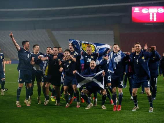 Stephen O'Donnell (far right) celebrates reaching the Euro 2020 Finals with Scotland