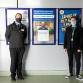 Joe Healy (left) and Ben Salmons with one of the NHS posters
